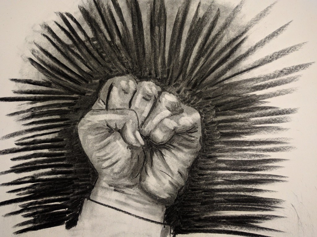 Black and white illustration of a solidarity fist